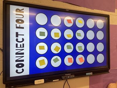 An interactive board displays a Connect Four-style game.