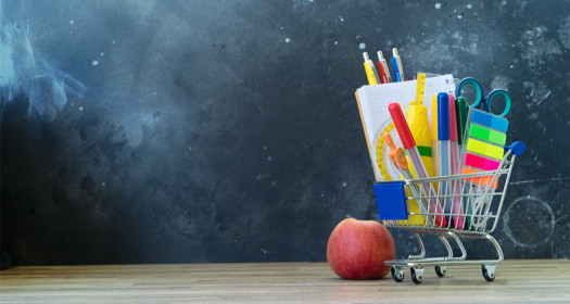 Miniature shopping cart with teaching supplies.