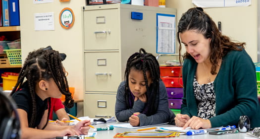 Teacher with two students. 