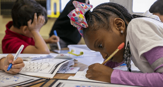 Student working independently in a classroom. 
