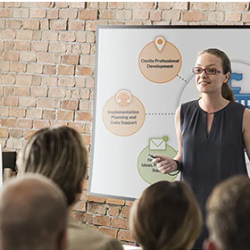 A teacher in front of a class.